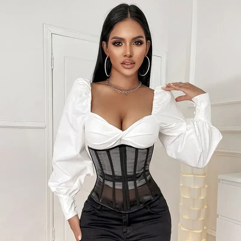 Black sheer mesh underbust corset worn over a white blouse